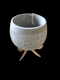 grey pot with wooden legs